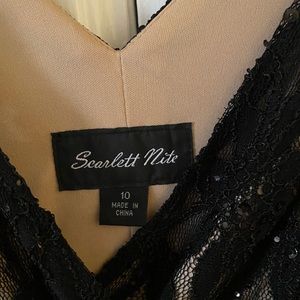 Black sheer dress. Knee length. New with tags